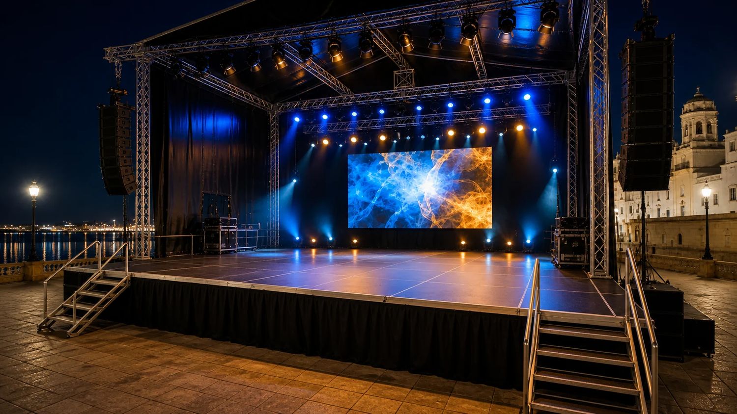 Escenario cubierto con pantalla LED, line array e iluminación de color